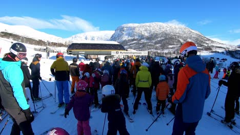 Skiers-in-line-for-ski-lift,-Myrkdalen-Ski-Resort,-Norway,-Easter-weekend