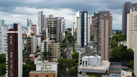 Aerial-view-flying-in-middle-of-condos-in-Porto-Alegre,-cloudy-day-in-Brazil