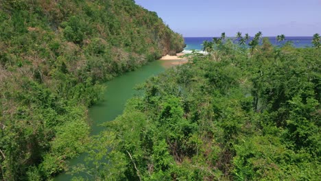 Rio-San-Juan-flowing-into-Playa-El-Valle-Beach,-Samana-in-Dominican-Republic
