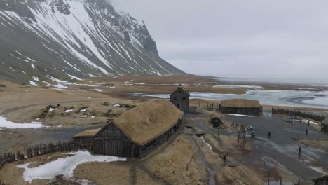 Aerial-View-of-Viking-Village-Settlement,-Abandoned-Movie-Location-on-Humid-Spring-Day,-Drone-Shot