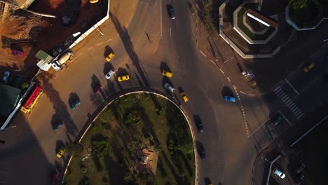 Aerial-view-above-traffic,-revealing-the-downtown-of-Yaounde,-Cameroon---tilt,-drone-shot