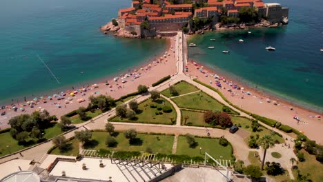 Sveti-Stefan-Park,-Island-And-Beach-With-Tourists-During-Summer-In-Budva,-Montenegro