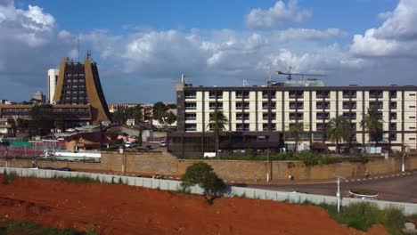 Aerial-view-in-front-of-buildings-in-downtown-Yaounde-from-Quartier-du-Lac-Muncipal,-in-sunny-Cameroon