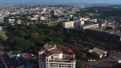 Aerial-view-descending-in-front-of-the-Hilton-hotel-in-downtown-Yaounde,-Cameroon