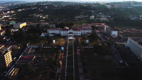 Aerial-view-in-front-of-the-National-museum-in-Yaounde-city,-Cameroon,-Africa---descending,-tilt,-drone-shot