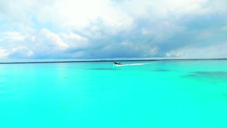 passage-of-a-pleasure-boat-on-a-turquoise-blue-sea-in-zanzibar