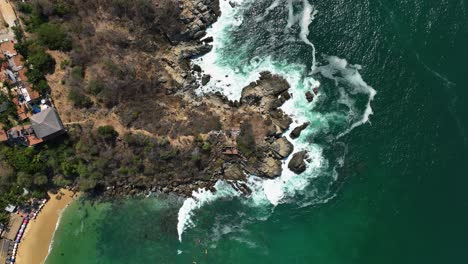 Waves-crashing-the-coast-of-Puerto-Escondido,-Oaxaca,-Mexico---cenital,-drone-shot