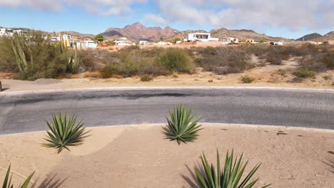 Aerial-video-of-a-traffic-roundabout-planted-with-Maguey-desert-plant