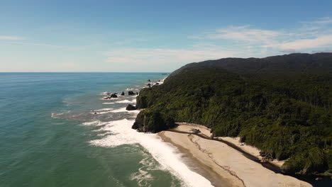 Aerial-over-the-coast-road-along-Bruce-Bay-in-South-Westland,-South-Island,-New-Zealand,-Drone-orbit-dolly-forward-shot