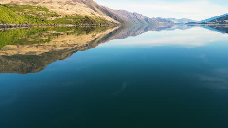 Aerial-of-the-reflections-in-the-water-of-Lake-Wanaka-in-Otago,-New-Zealand