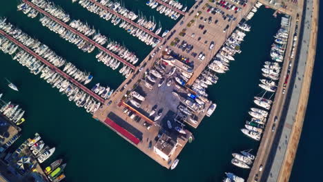 Stunning-Aerial-Shot-Flying-Over-Boats-in-Harbour-in-Barcelona