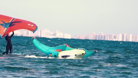 Los-Alcazares,-Spain,-May-3,-2023:-Sportsman-practicing-kite-surf-sport-at-the-beach-on-a-windy-day-at-the-Spanish-coasts