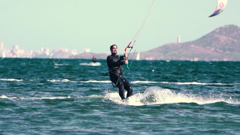 Sportsman-practicing-kite-surf-sport-at-the-beach-on-a-windy-day-at-the-Spanish-coasts