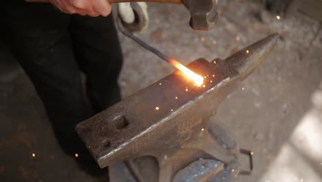 A-blacksmith-reenactor-brings-history-to-life-by-portraying-a-traditional-blacksmith,-showcasing-the-art-and-trade-of-metalworking-with-authentic-tools-and-methods