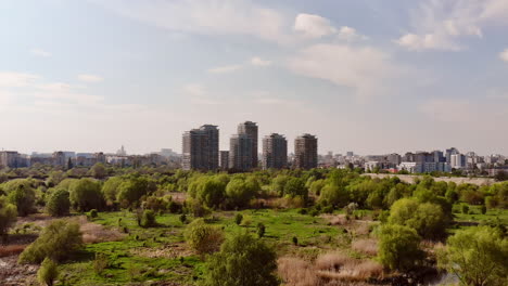 City-skyline-residential-buildings-from-Vacaresti-natural-reservation,-Bucharest-Romania