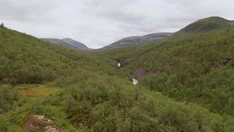 Drone-shot-of-Norway-remote-rocky-landscape-with-lakes,-forests-and-rivers
