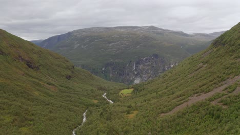 Drone-shot-of-Norway-remote-rocky-landscape-with-lakes,-forests-and-rivers