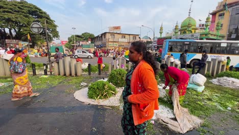 A-shot-of-a-woman-selling-decorative-green-garlands-by-the-streets-in-Bangalore