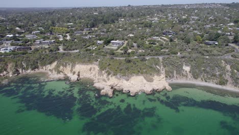 Turquoise-Ocean-And-The-Pillars-In-Mount-Martha,-Australia---aerial-shot