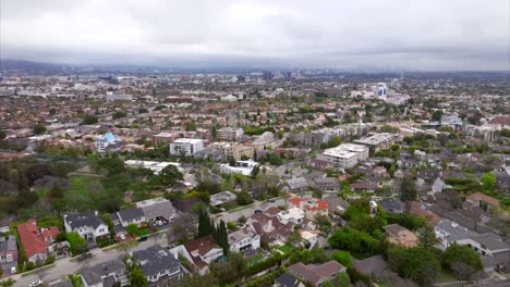 Aerial-view-flyover-vast-Beverly-hills-wealthy-suburban-residential-property-neighborhood-community