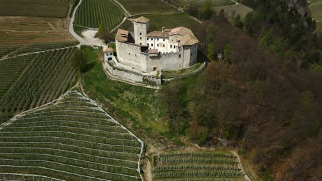 Medieval-stone-castle-next-to-cultivated-fields