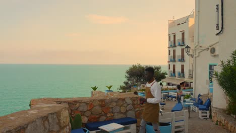 Bar-And-Restaurant-With-Sea-Views-At-Dusk-In-Peniscola,-Castellon,-Spain