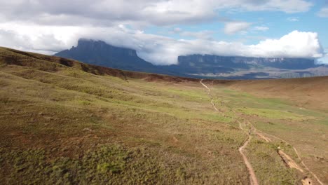 Aerial-view-of-a-group-of-people-hiking-a-trail-through-Roraima-Tepui-in-Canaima-National-Park