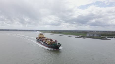 MSC-container-ship-sailing-off-Dutch-coast-on-cloudy-day