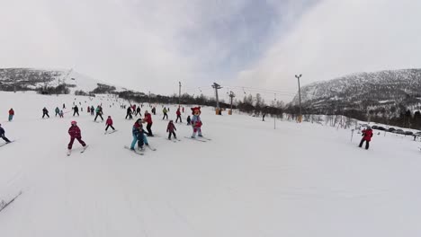 Mascot-Mikkel-and-Mikkeline-skiing-down-childrens-hill-in-Myrkdalen-Norway