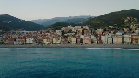 Tilt-down-over-Varazze-city-in-Liguria-region,-Italy