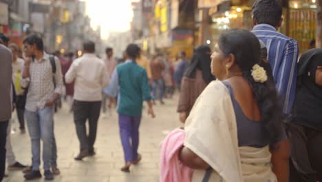 Indian-people-travelling-and-shopping-across-Charminar-Jewellery-market,-women-wearing-traditional-hijab,-burka-and-fully-covered,-slow-motion