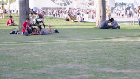 People-chilling-in-front-of-Museu-do-Amanha,-Tomorrow's-museum,-at-Praca-Maua,-in-Rio-de-Janeiro,-Brazil