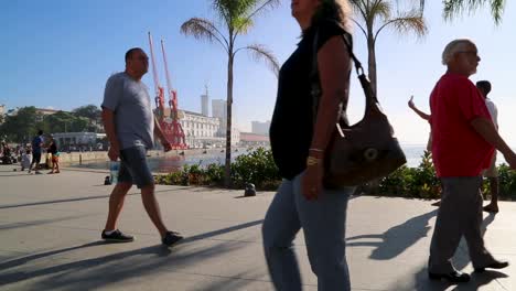 Fat-people,-people-eating-icecream,-people-taking-selfies-walking-around-at-Praca-Maua,-at-sunset,-in-the-center-of-Rio-de-Janeiro,-Brazil