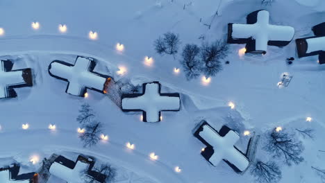 Cross-shape-huts-in-snowy-landscape-in-Snowhotel-Kirkenes,-Norway