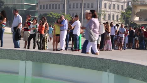 People-in-line-in-front-of-Museu-do-Amanha,-Tomorrow's-museum,-at-Praca-Maua,-in-the-center-of-Rio-de-Janeiro,-Brazil,-on-a-Sunday-afternoon