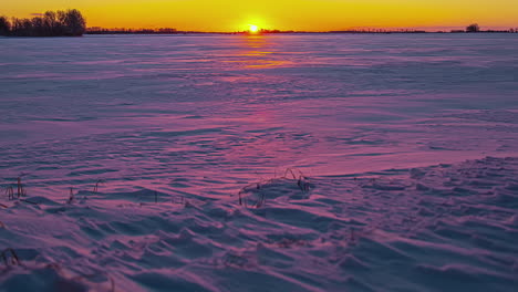 Colorful-sunrise-over-snowy-landscape.-Timelapse