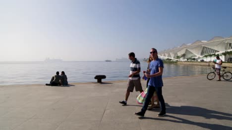 People-walking-around-at-Praca-Maua,-in-the-center-of-Rio-de-Janeiro,-Brazil,-on-a-Sunday-afternoon