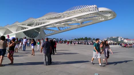 People-relaxing-at-Praca-Maua,-at-sunset,-in-the-center-of-Rio-de-Janeiro,-Brazil,-on-a-Sunday-afternoon