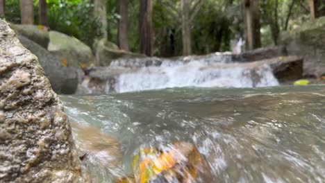 Close-up-cinematic-shot-of-small-river-waterfall