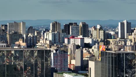 Telephoto-drone-shot-of-colorful-buildings,-golden-hour-in-Porto-Alegre,-Brazil
