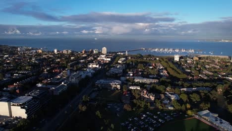 Aerial-forward-over-residential-area-in-Melbourne,-Australia,-ocean-view,-drone