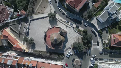 aerial-Top-down-fly-over-view-of-Santo-Amaro-church-near-Lisbon-town