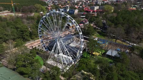 Aerial-view-Ferris-wheel-in-the-center-of-Palanga-City's-summer-resort-town