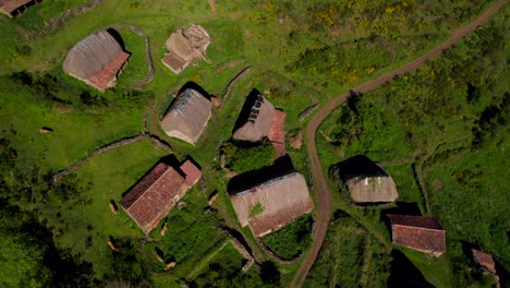 Aerial-view-of-Braña-Pornacal-straw-rural-huts-village-in-Asturias,-Spain