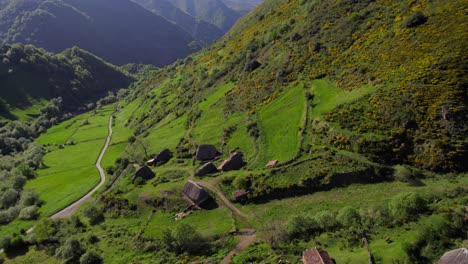 Cinematic-aerial-dolly-out-view-of-Pornacal-braña-remote-rural-village-in-Asturias,-Spain