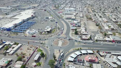 View-from-a-drone-flying-away-from-a-monument-of-the-mexican-ex-president-Francisco-Zarco-in-the-middle-of-a-roundabout-in-the-city-of-Mexicali