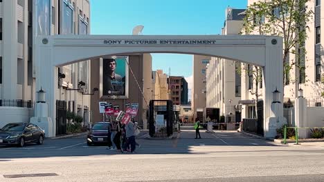 Writers-Guild-of-America-striking-in-front-of-Sony-Pictures,-WGA,-people-with-Pickett-signs