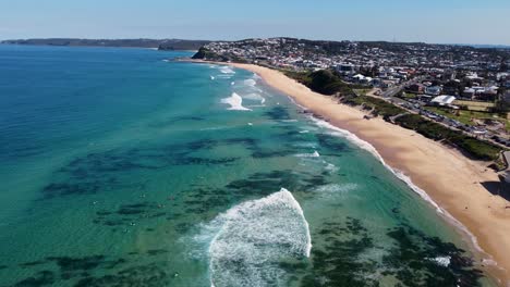 Aerial-drone-shot-Merewether-beach-pan-landscape-nature-view-Pacific-Ocean-travel-tourism-Hamilton-Bar-Beach-The-Hill-Newcastle-real-estate-NSW-Australia-4K
