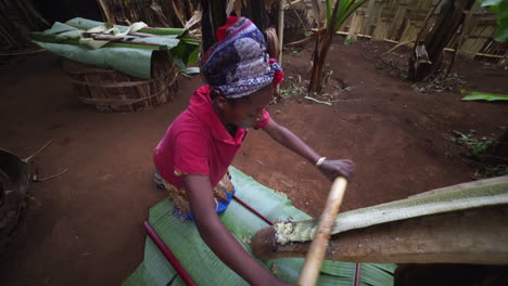 Dorze-black-tribal-woman-in-Ethiopia-preparing-Kocho-bread-3