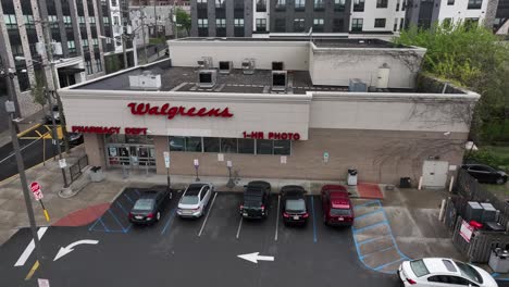 Aerial-push-in-shot-of-Walgreens-Pharmacy-and-1-hour-photo